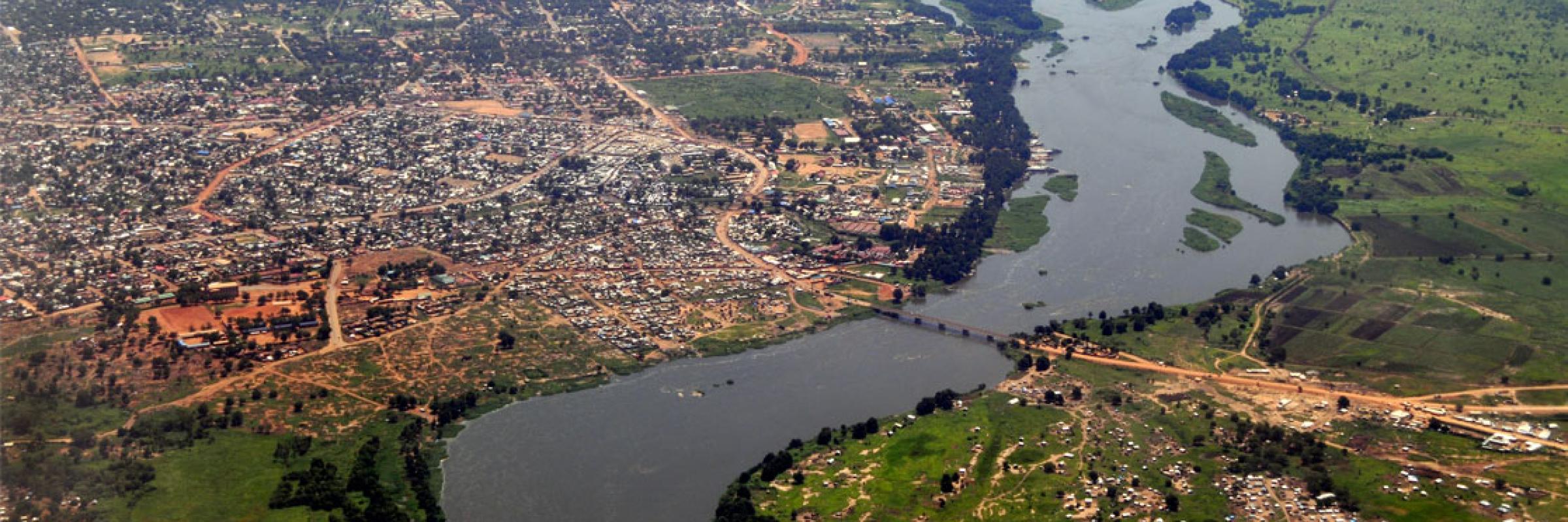 Aerial image of a settlement with a river running through it