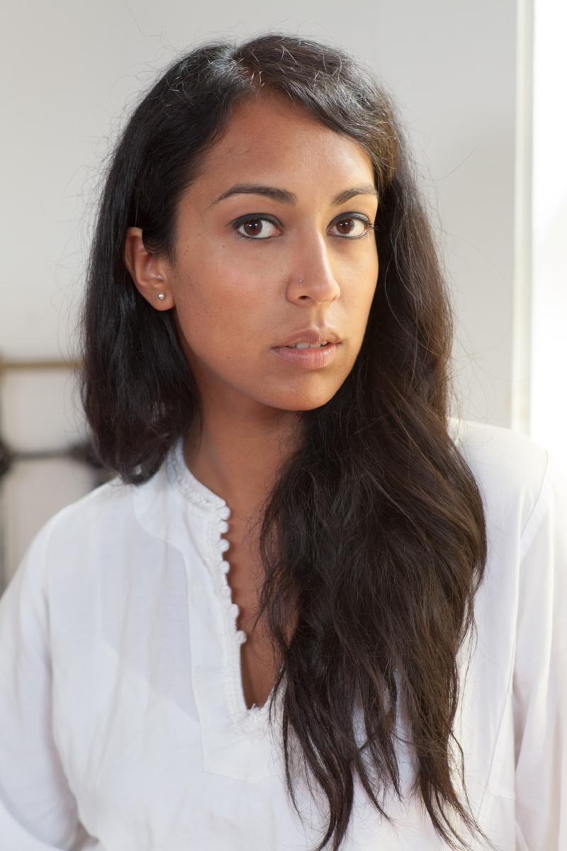 Image of a person with long hair looking at the camera