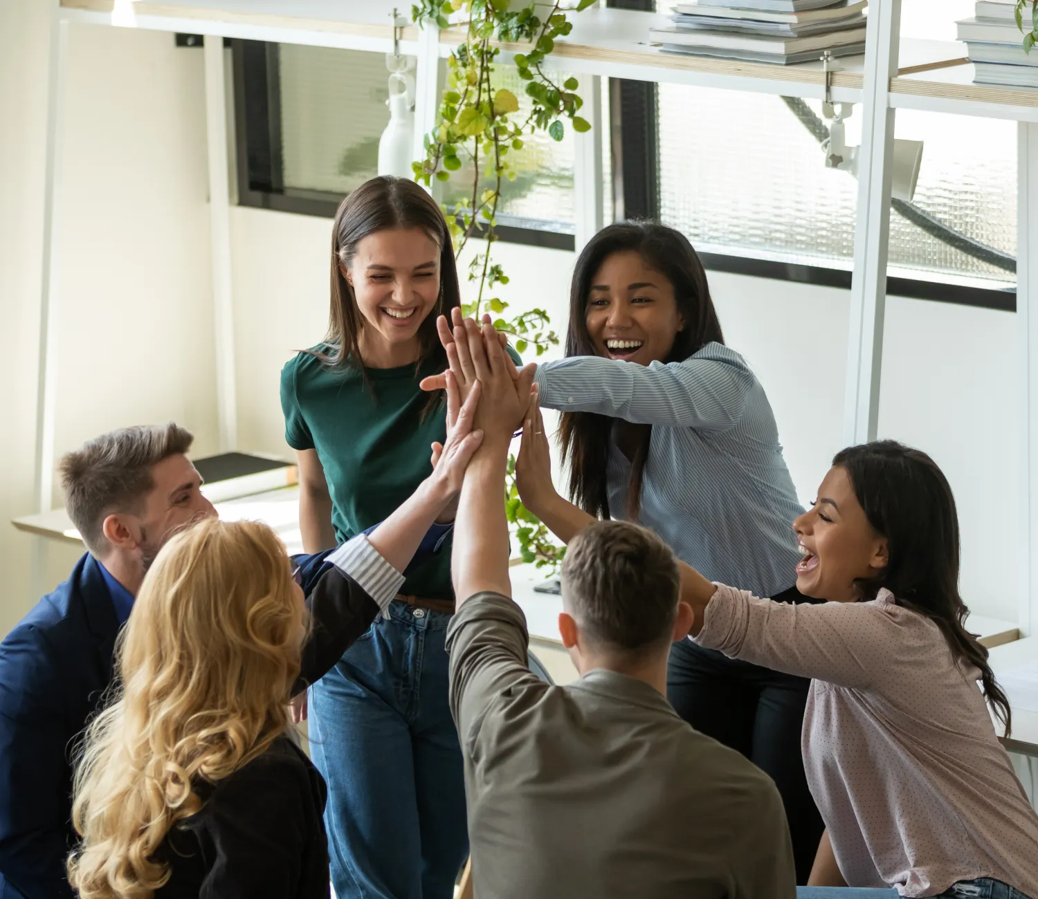 image of a group of people putting their hands together